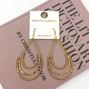 Layered Open Teardrop Earrings With Beads in Gold Tone